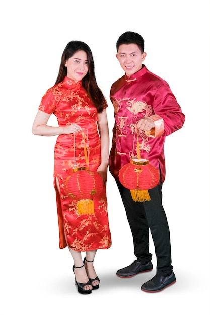 Chinese couple holding red lantern on studio