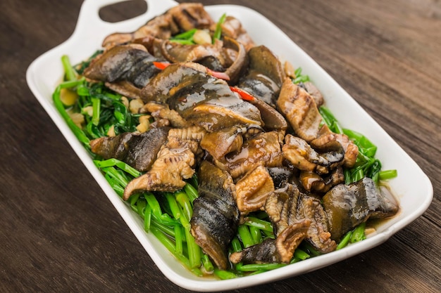 Chinese Cuisine fried eel with a plate of cabbage