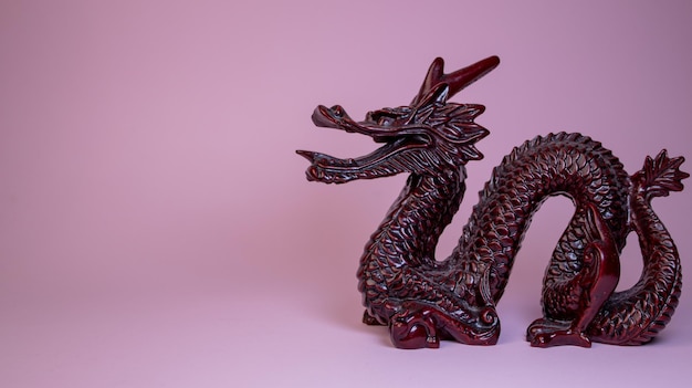 Chinese dragon figure on pink background