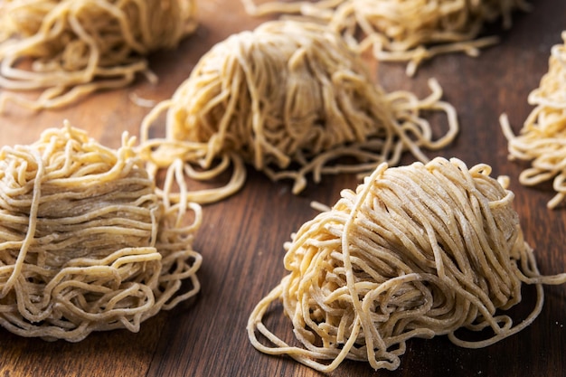 Chinese dry egg noodles on table