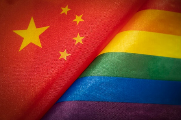 Chinese flag and flag of the LGBT community The problem of the rights of sexual minorities in the country Protection and infringement of human rights nontraditional relations and politics concept