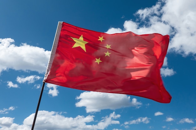 The Chinese flag waved in the wind in the blue sky.