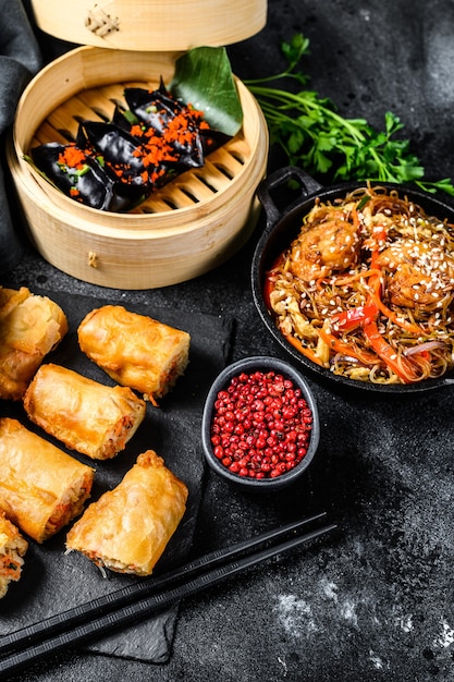 Chinese food. Noodles, dumplings, stir fry chicken, dim sum, spring rolls. Chinese cuisine set