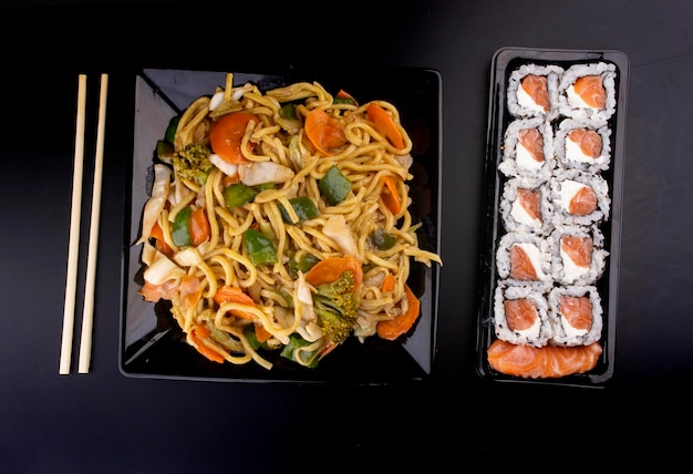 Chinese food plate black vegetarian yakisoba 10 sushi philadelphia plate in open delivery carton top view