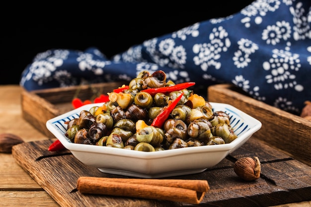 Chinese food: Stir fried snails with thirteen spices