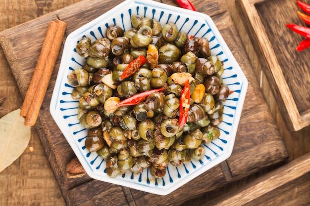 Chinese food: Stir fried snails with thirteen spices