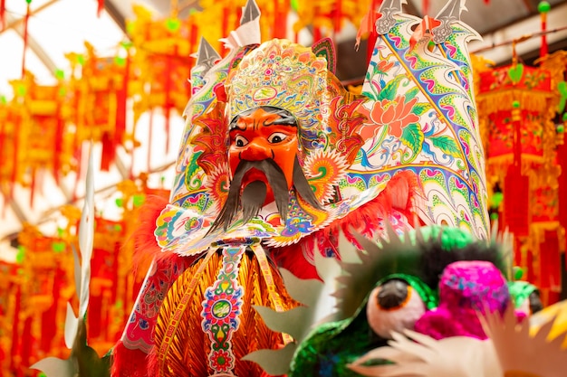 Chinese Ghost Festival people use colorful paper gods to sacrifice