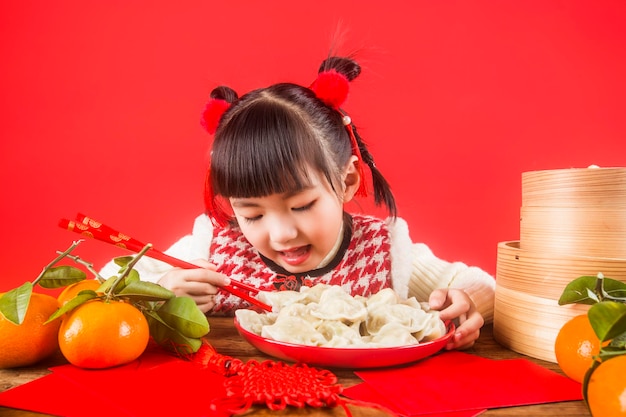 A Chinese girl is happy to welcome the Spring Festival