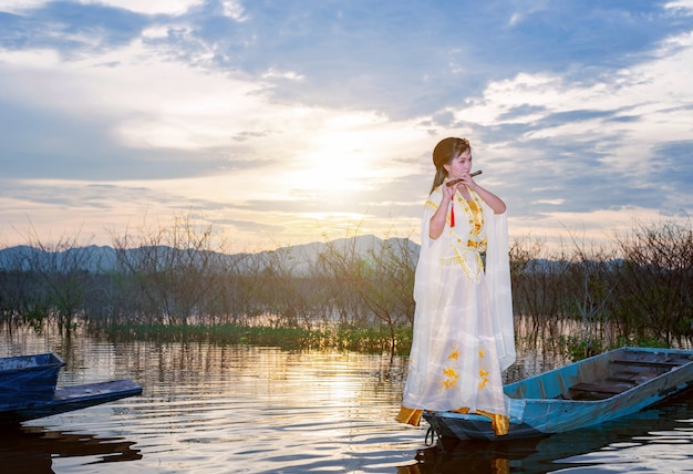 Chinese girl is playing the traditional Chinese musical instrument 