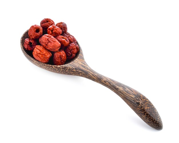 Chinese jujube isolated In wooden spoon