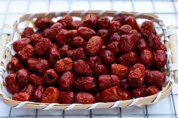 Chinese jujubes isolated in bamboo basket