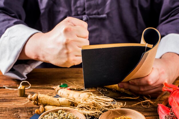 A Chinese medicine practitioner is selecting ginseng traditional Chinese medicine