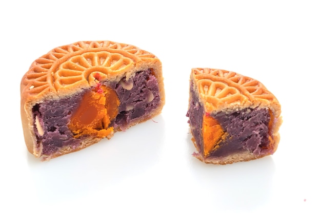 Chinese moon cake purple sweet potato and egg yolk flavour isolated on white background