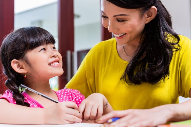 Chinese mother homeschooling her child