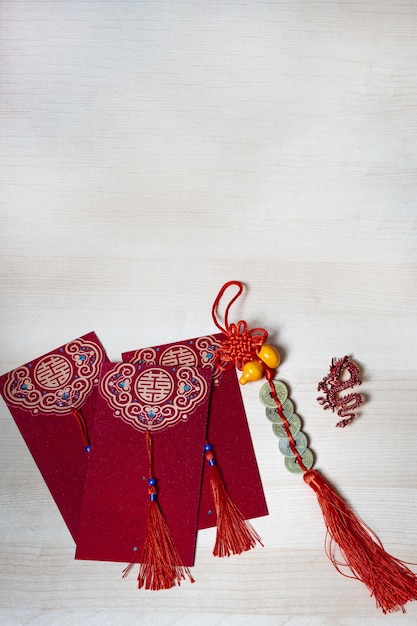 Chinese new year decorations and gold ingots or golden lump on wooden background Still life