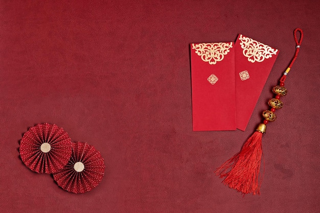 Chinese new year decorations made from chinese good fortune symbol red envelopes and paper fans