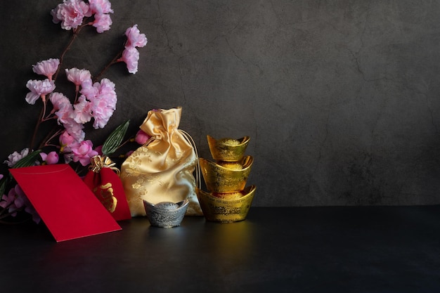 Chinese new year festival decorations pow or red packet, orange and gold ingots or golden lump 