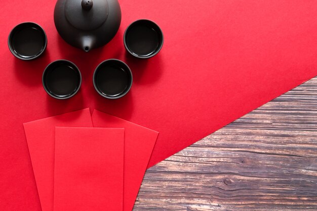 Chinese New Year offering red envelope and Chinese tea pot