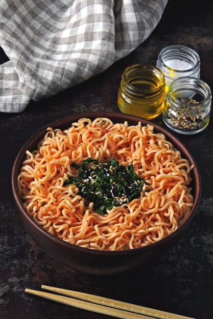 Chinese Noodle Bowl. A bowl of tomato noodles. Colorful healthy food in the style of flat lay