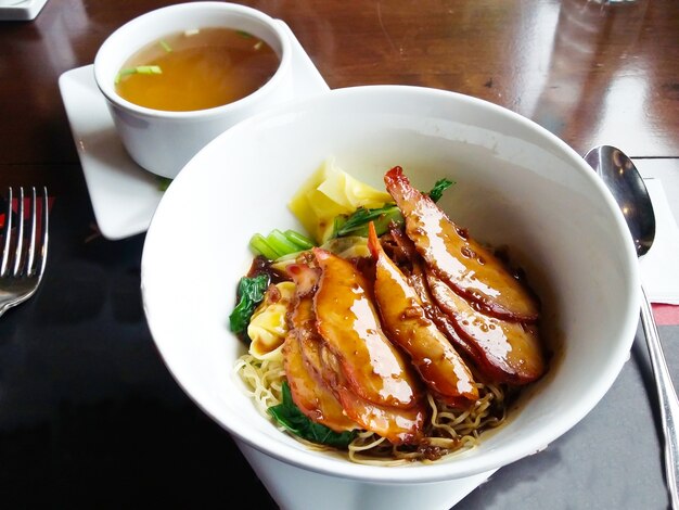 Chinese noodle topping barbecue pork and soup