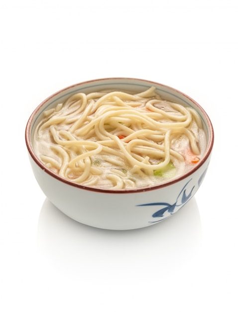 Chinese noodle or udon with vegetables and chopstick on isolated white