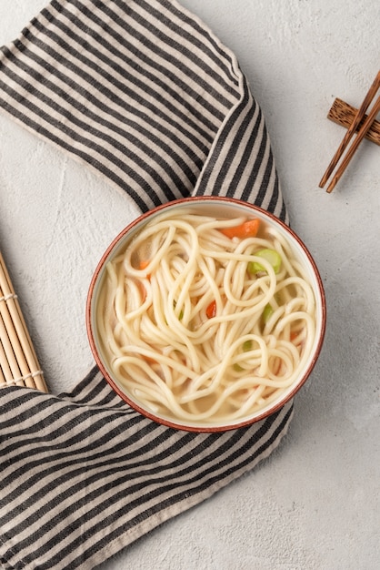 Chinese noodle or udon with vegetables and chopstick