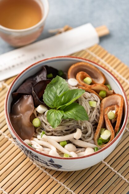 Chinese noodle with mushroom vegetables and chopstick