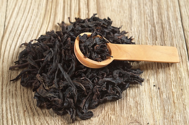 Chinese oolong tea dahongpao on wooden background