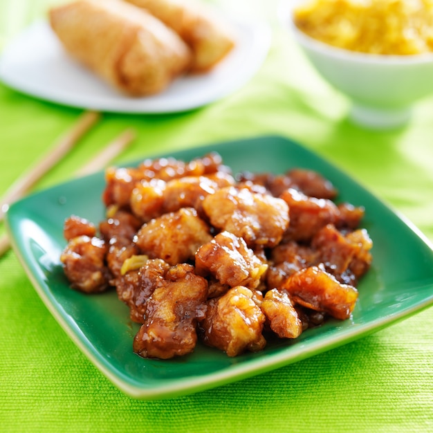 Chinese orange chicken on a green plate