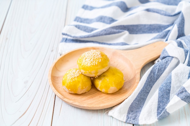 Chinese pastry or moon cake filled with mung bean paste and salted egg yolk 