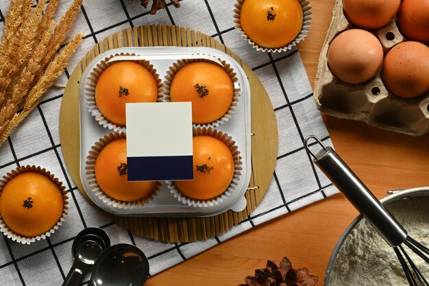 Chinese pastry with stuffed salted yolk on wooden kitchen table Traditional dessert for Chinese MidAutumn festival