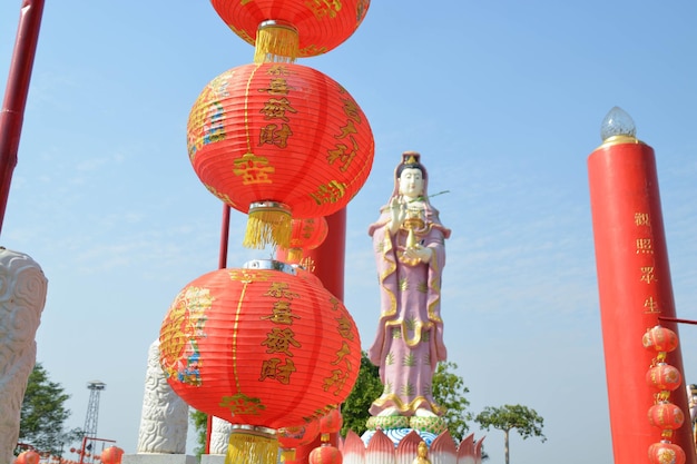 Chinese red lantern has written lucky and chinese pattern decoration hanging front of the Guan Yin