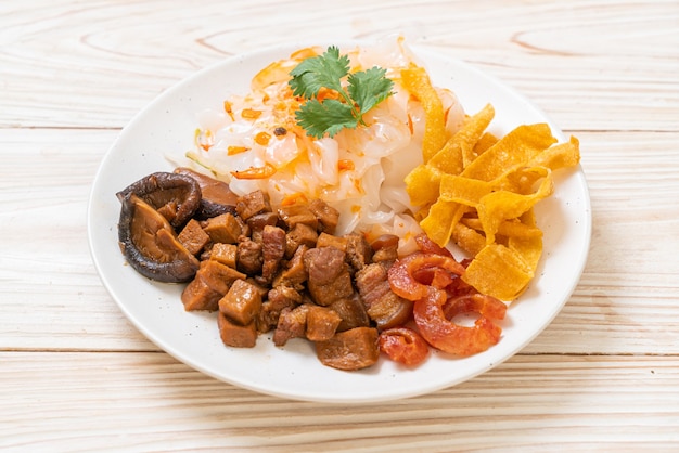 Chinese steamed rice noodle with pork and tofu in sweet soy sauce