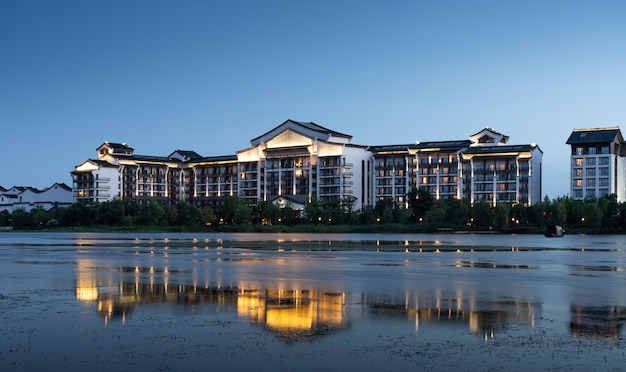 Chinese style buildings by the lake in the evening