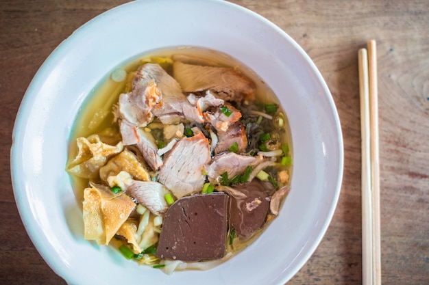 Chinese Style Noodle Topped with Barbeque Pork and Crispy Wonton 