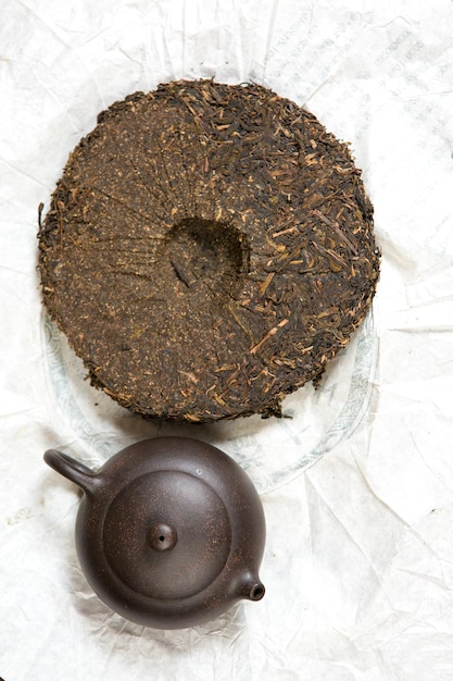 Chinese tea ceremony Ceramic teapot made of clay and bowls on a wooden background