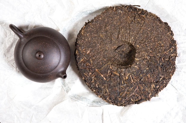 Chinese tea ceremony Ceramic teapot made of clay and bowls on a wooden background