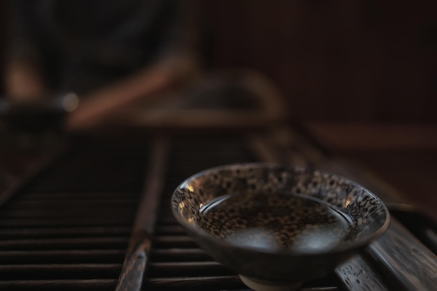 Chinese tea ceremony, tea table, cup / teapot on the table,\
oriental traditions