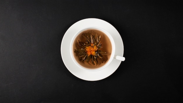  Chinese tea flower with white mug on dark background