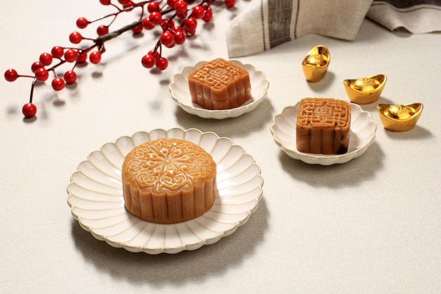 Chinese Traditional Pastry Moon Cake Mooncake on Ceramic Plate on Wooden Background for Mid Autumn Festival