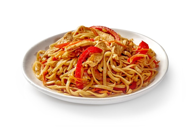 Chinese udon noodles with stir fried veal and vegetables served on plate