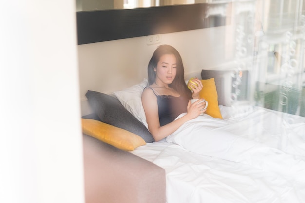 Chinese woman alone in bed