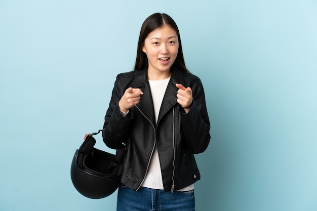 Chinese woman holding a motorcycle helmet isolated