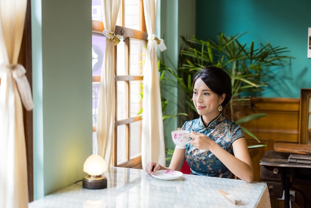Chinese woman in the traditional vintage tea house