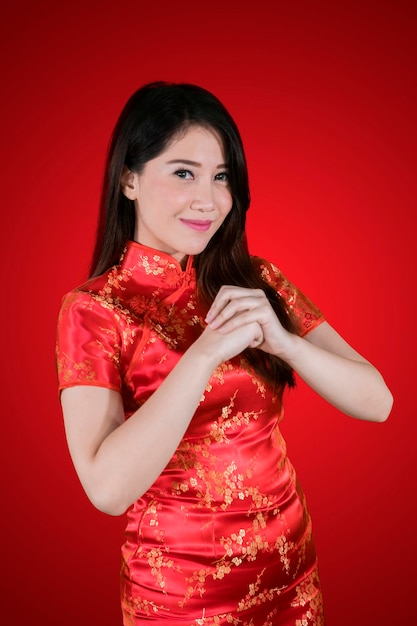 Chinese woman with gesture of congratulations