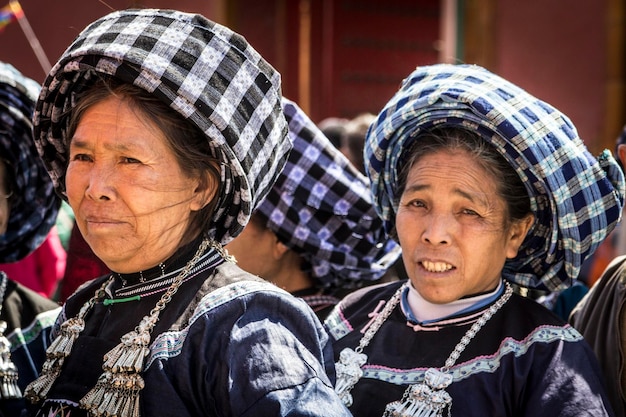 Chinese women wearing plaid shawls on their heads visiting Beijing, China