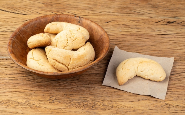 Chipas, typical south american cheese bun over wooden table.