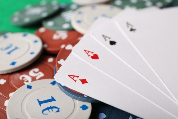 Chips and cards on table, closeup