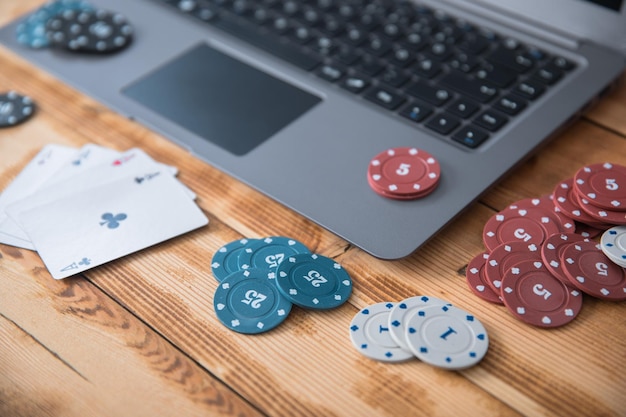 Chips and playing cards on keyboard