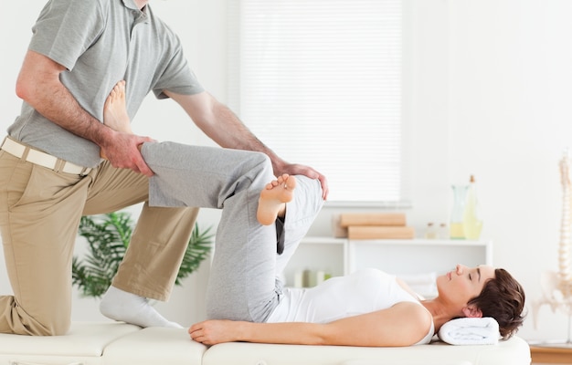 Chiropractor working with a woman